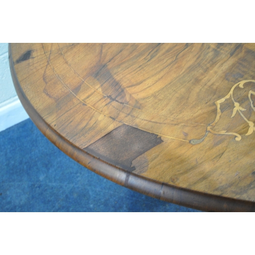 168 - AN OVAL BURR WALNUT TILT TOP LOO TABLE, with marquetry inlay, raised on turned supports, and shaped ... 