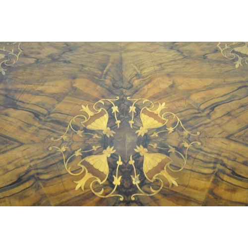 168 - AN OVAL BURR WALNUT TILT TOP LOO TABLE, with marquetry inlay, raised on turned supports, and shaped ... 