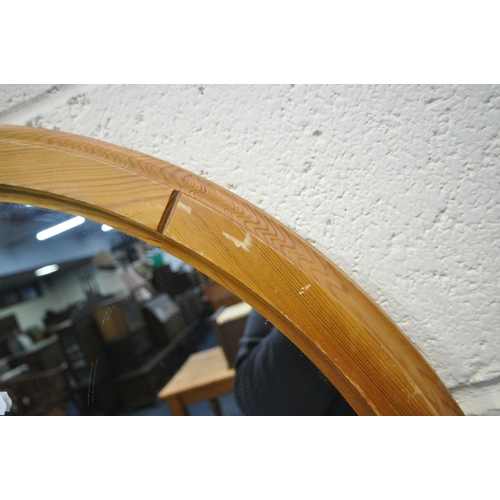 172 - A PAIR OF CIRCULAR PINE FRAMED WALL MIRRORS, diameter 60cm, along with two other wall mirrors, condi... 