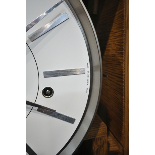 188 - A MODERN OAK CASED CHIMING LONGCASE CLOCK, the glass door enclosing a 10.5 inch dial, depicting Roma... 