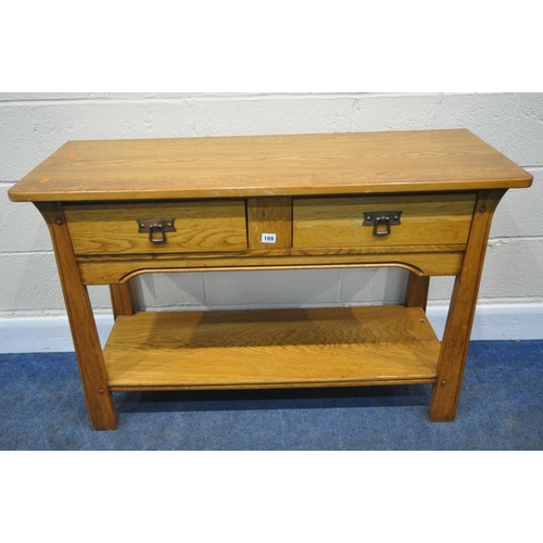 189 - A MODERN OAK SIDE TABLE, with two frieze drawers, raised on shaped legs, united by an undershelf, an... 