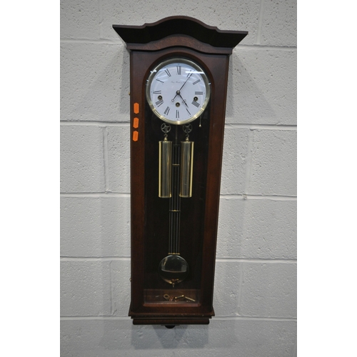 190 - A LATE 20TH CENTURY WALL HANGING CHIMING CLOCK, the arched glass door enclosing a 6.5 inch dial, sig... 