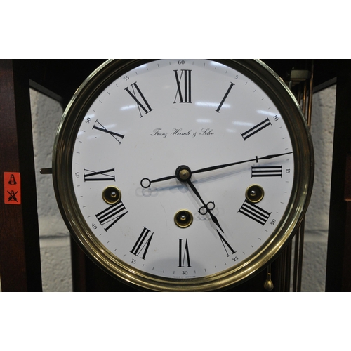 190 - A LATE 20TH CENTURY WALL HANGING CHIMING CLOCK, the arched glass door enclosing a 6.5 inch dial, sig... 