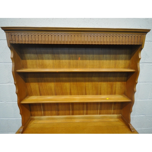 192 - A LATE 20TH CENTURY OAK DRESSER, the two tier plate rack, atop a base with two drawers, over double ... 