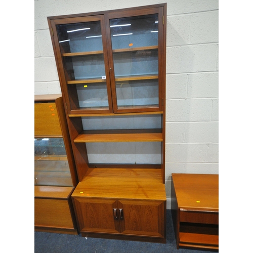 205 - THREE PIECES OF MID CENTURY TEAK FURNITURE, to include a wall cabinet, with double glass doors, atop... 