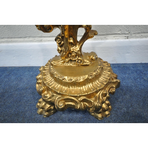 215 - A 20TH CENTURY ROCOCO STYLE GILT RESIN STAND, with an oval surface held aloft by a young boy in foli... 