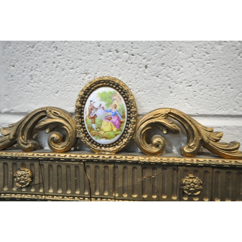 218 - A 19TH CENTURY FRENCH GILT FRAMED BEVELLED EDGE WALL MIRROR, the scrolled crest and each corner with... 