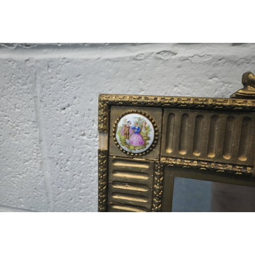 218 - A 19TH CENTURY FRENCH GILT FRAMED BEVELLED EDGE WALL MIRROR, the scrolled crest and each corner with... 