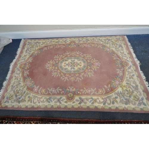 222 - A RED GROUND SHIRAZ RUG, with repeating geometric patterns, united by a multi-strap border, 173cm x ... 