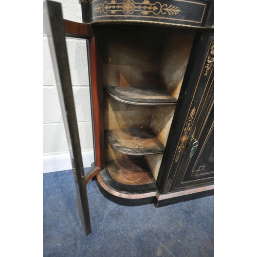 228 - A 19TH CENTURY EBONISED CREDENZA, fitted with two curved glass doors, flanking a larger central door... 