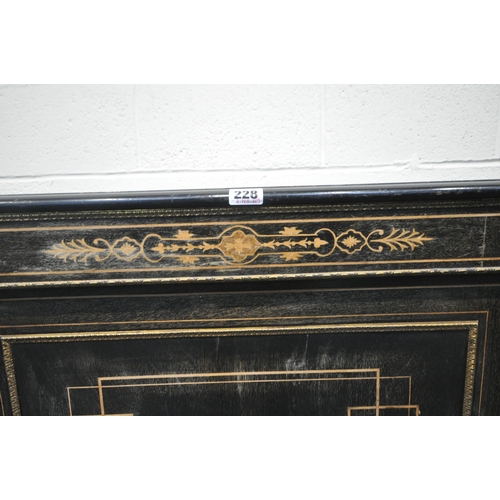 228 - A 19TH CENTURY EBONISED CREDENZA, fitted with two curved glass doors, flanking a larger central door... 