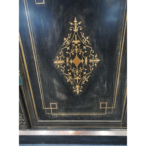 228 - A 19TH CENTURY EBONISED CREDENZA, fitted with two curved glass doors, flanking a larger central door... 