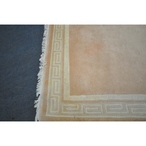 229 - A SALMON PINK GROUND RECTANGULAR RUG, with spiral design border, 241cm x 171cm, condition report: in... 