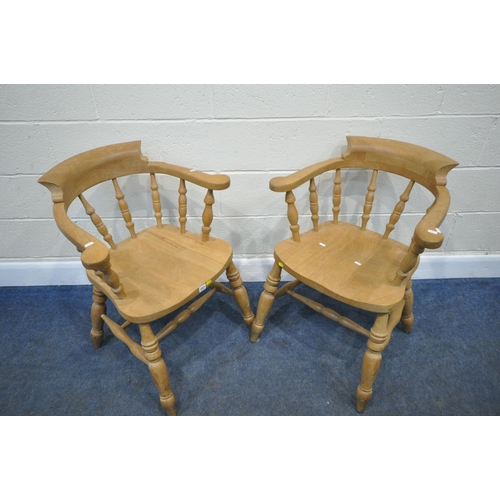 237 - A PAIR OF BEECH BOW TOP CAPTAINS CHAIRS, with shaped armrests, raised on turned legs, united by stre... 