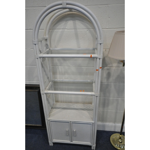 239 - A WHITE PAINTED RATTAN OPEN SHELVING UNIT, with glass shelves, over double doors, width 66cm x depth... 