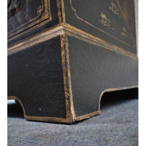 253 - A BLACK LACQUERED DRINKS CABINET, fitted with double cupboard doors, over three drawers, with variou... 