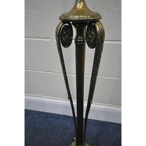 267 - A 20TH CENTURY BRASS STANDARD LAMP, with a foliate pillar, triple rams head, three scrolled supports... 