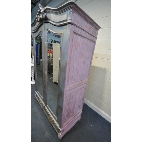 273 - A SILVER AND PURPLE PAINTED WARDROBE, the arched top with scrolled design, double bevelled mirror do... 