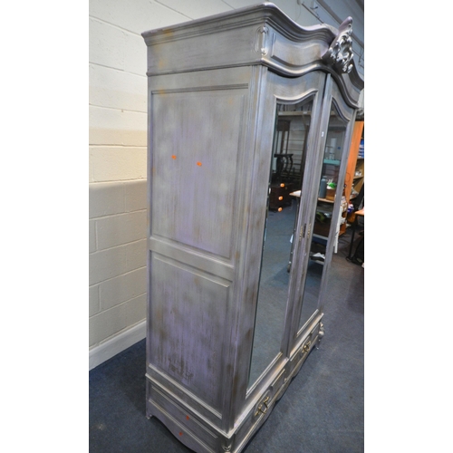 273 - A SILVER AND PURPLE PAINTED WARDROBE, the arched top with scrolled design, double bevelled mirror do... 