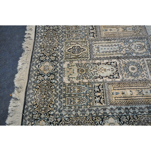 278 - A RECTANGULAR WOOLEN RUG, with various colours, geometric patterns, surrounded by a multi-strap bord... 