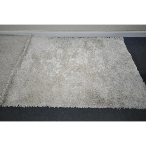 281 - TWO CREAM DEEP PILE RECTANGULAR RUGS, largest 230cm x 164cm, condition report: both with general sig... 