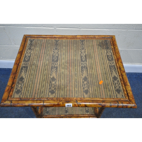 283 - A TIGER BAMBOO RECTANGULAR TWO TIER TABLE, both tiers with fabric inlay, width 65cm x depth 51cm x h... 