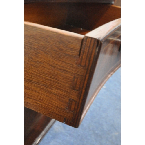 288 - A REPRODUCTION MAHOGANY SERPENTINE SIDE TABLE, with two frieze drawers, raised on square tapered leg... 