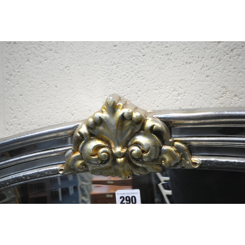 290 - A SILVER AND GOLD PAINTED ARCHED OVERMANTEL BEVELLED EDGE WALL MIRROR, 217cm x 90cm, condition repor... 