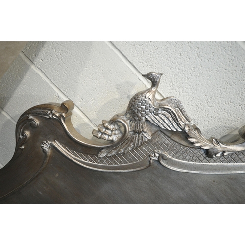 291 - AND SO TO BED, A LOUIS XVI STYLE SILVER 5FT BEDSTEAD, the headboard with intricate carved details, i... 