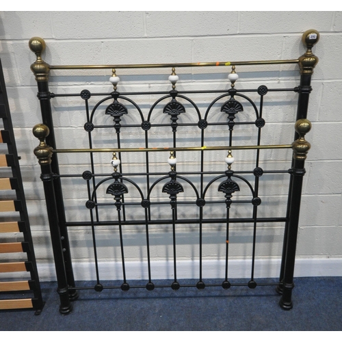 292 - A BLACK TUBULAR METAL 4FT6 BEDSTEAD, with side rails, slats, and bolts, condition report: one cerami... 