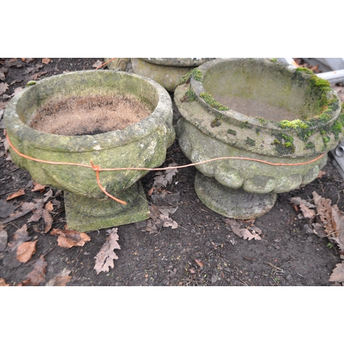 14 - THREE WEATHERED COMPOSITE GARDEN PLANTERS, two with fluted blustered bowls, the other with rope and ... 