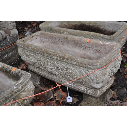 16 - A PAIR OF RECTANGULAR WEATHERED COMPOSITE GARDEN PLANTERS, with mythical creature and human mask det... 