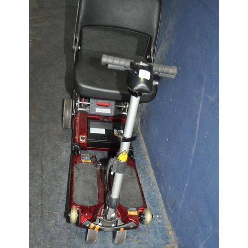 2 - A LUGGIE FOLDING DISABILITY SCOOTER (SPARES OR REPAIRS), with charger, one battery fitted but doesn'... 