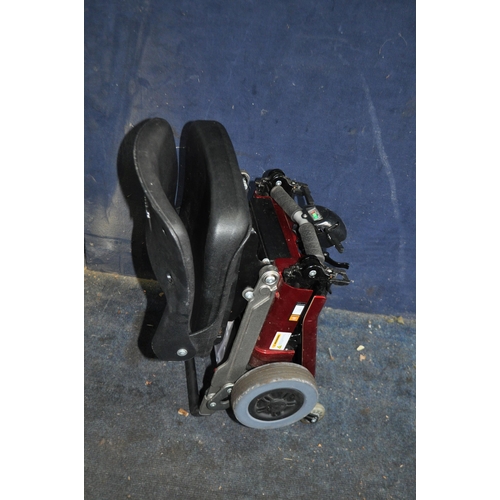 2 - A LUGGIE FOLDING DISABILITY SCOOTER (SPARES OR REPAIRS), with charger, one battery fitted but doesn'... 