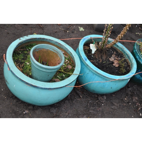 28 - FOUR GREEN GLAZED CERAMIC PLANT POTS,  including a pair of large balustered pots 50cm in diameter, o... 