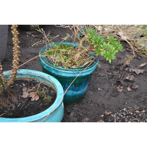 28 - FOUR GREEN GLAZED CERAMIC PLANT POTS,  including a pair of large balustered pots 50cm in diameter, o... 