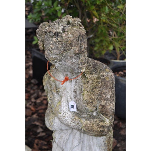 35 - A COMPOSITE GARDEN FIGURE in the form of a Grecian lady with flowing robes, height 115cm. Condition ... 