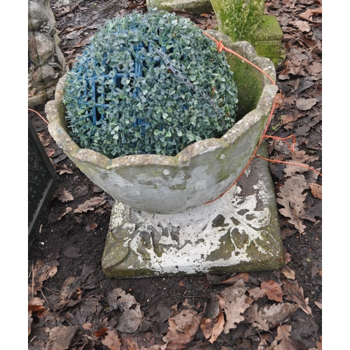 38 - A MODERN COMPOSITE GARDEN URN  with a wave top edge and square base with foliate details, diameter 4... 