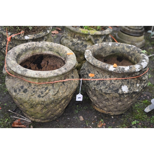 5 - A SET OF FOUR WEATHERED COMPOSITE GARDEN PLANTERS diameters 30cm