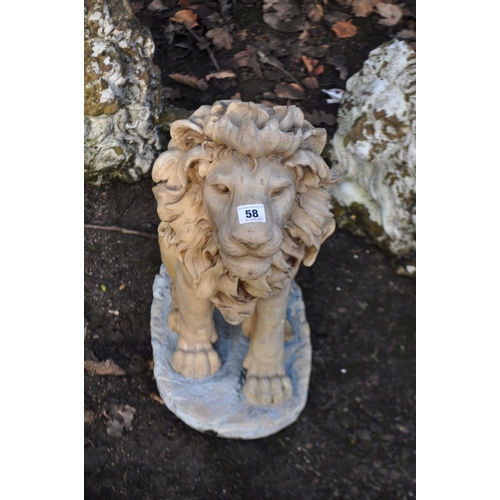 58 - A PAIR OF COMPOSITE FLAT BACK LION FIGURES 65cm long and a resin seated lion figure with pierced fre... 