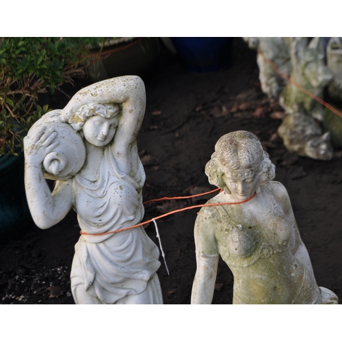 59 - A MODERN COMPOSITE GARDEN FIGURE IN THE FORM OF A 1940s LADY leaning against a console table,  heigh... 