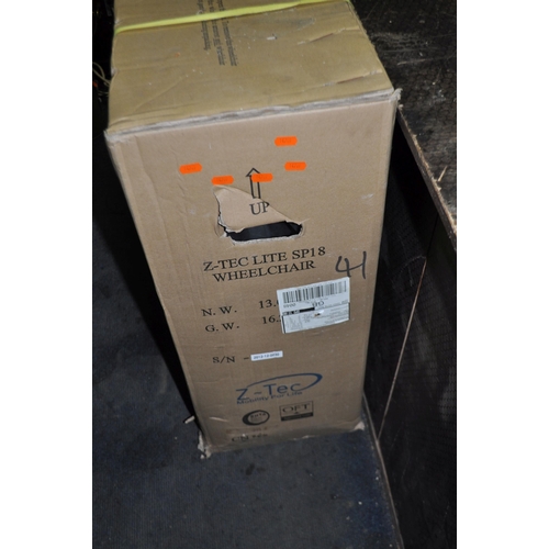 69 - A Z-TEC SP18 LITE FOLDING WHEELCHAIR appears to be brand new and sealed in box but contents not chec... 