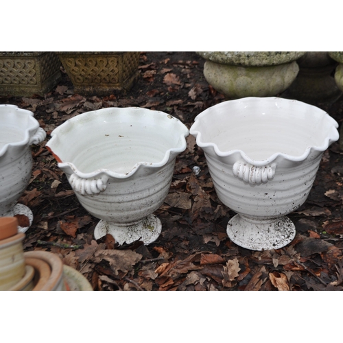 9 - A SET OF THREE WHITE GLAZED TERRACOTTA PLANT POTS with waved rims and two handles to each (one rim d... 