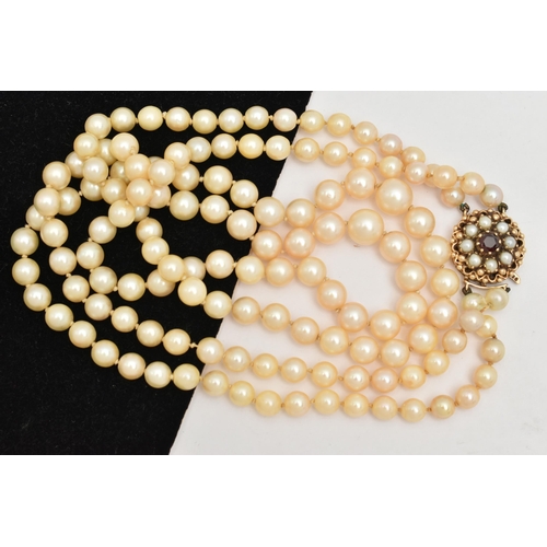 401 - A 9CT GOLD CULTURED PEARL NECKLACE, a double strand necklace of graduated white pearls with cream un... 