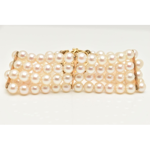 402 - A CULTURED PEARL BRACELET, a four strand bracelet of white cultured pearls with a pink hue, approxim... 