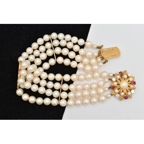 402 - A CULTURED PEARL BRACELET, a four strand bracelet of white cultured pearls with a pink hue, approxim... 