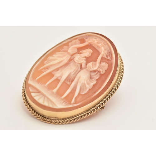 417 - A 9CT GOLD CAMEO BROOCH, carved oval shell depicting the three graces, milgrain collet set with a fi... 