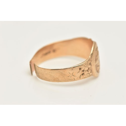 423 - A GENTS 9CT GOLD BELT AND BUCKLE RING, floral pattern belt with polished buckle detail, to the polis... 