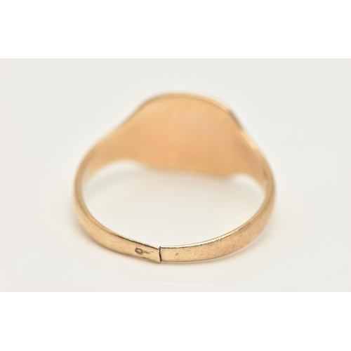 424 - A GENTS 9CT GOLD SIGNET RING, of a square form with a worn engraving, leading onto a polished split ... 