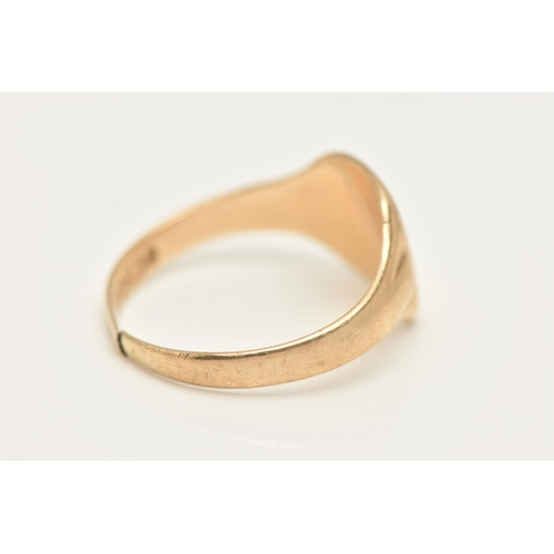 424 - A GENTS 9CT GOLD SIGNET RING, of a square form with a worn engraving, leading onto a polished split ... 